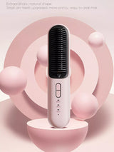 Pink cordless heated hair straightening comb with black comb teeth and three temperature indicators