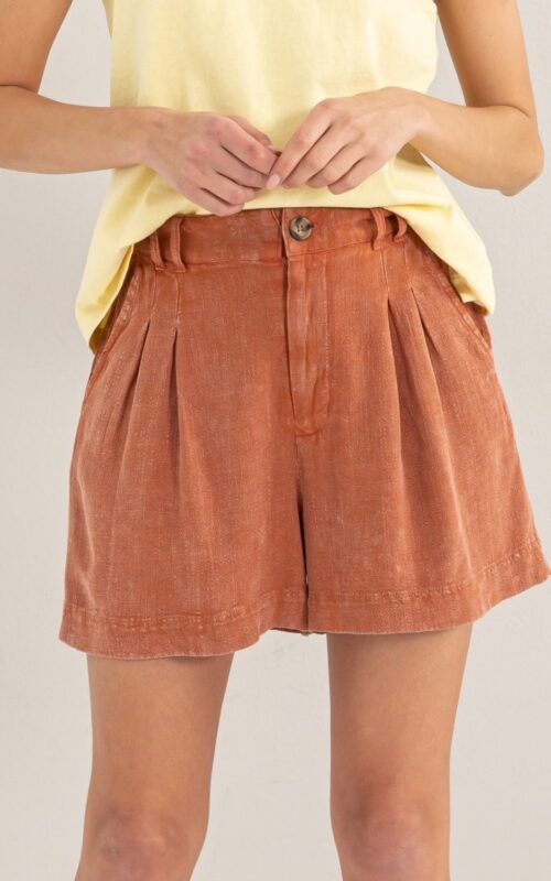 Close-up shot showing the mineral washed fabric and pleats of the High Waist Pleated Linen Shorts
