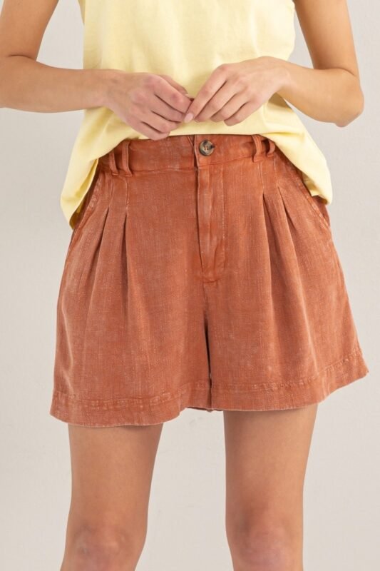 Close-up shot showing the mineral washed fabric and pleats of the High Waist Pleated Linen Shorts