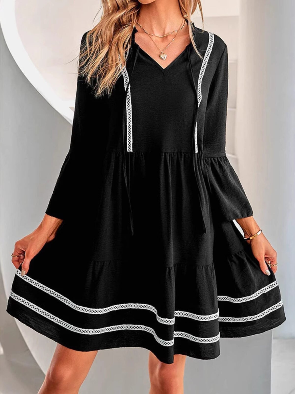 Black Long Sleeve Mini Dress with a Tiered Skirt and Contrast Trim