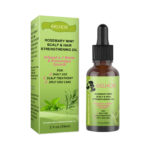 Professional Rosemary Mint hair growth oil bottle with a scalp massage tool on a clean white background.